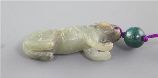 A Chinese celadon and black jade figure of a crouching tiger, Song dynasty style and possibly of the period, length 4.5cm